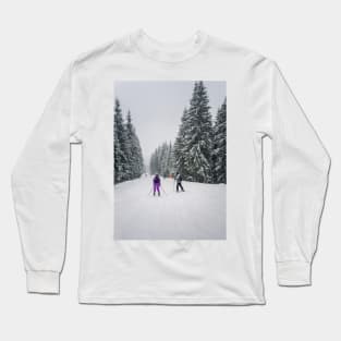 People skiing on the snowy slope Long Sleeve T-Shirt